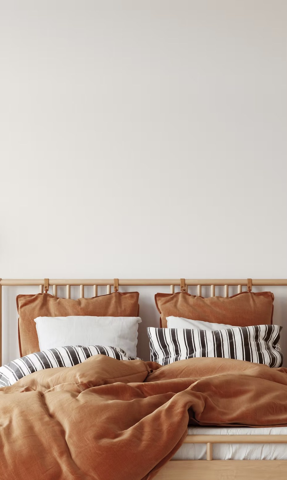 Bedroom with rust-colored linens