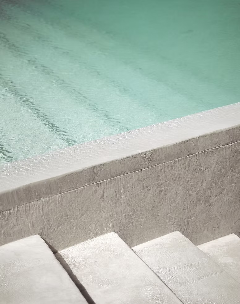 Pool steps with turquoise water
